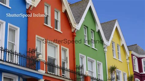 Yellow Red Orange Green Blue sky houses by the sea Whitehead in N ...