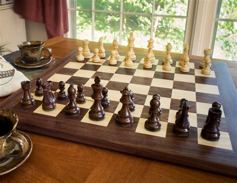 A gorgeous solid wood chess set with beautifully carved pieces. This is ...