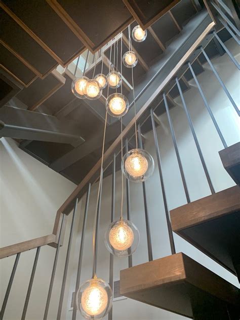 Foyer-two-story-chandelier-reflection Clear-glass-pendant-lighting ...