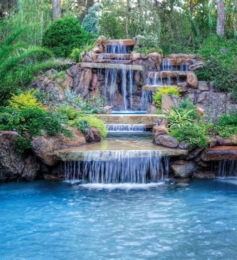 A 20-foot-high cascading waterfall with a two-sided spillway drops into ...