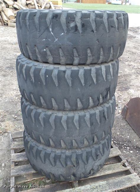 (4) Michelin 12R16.5 skid steer tires and wheels | Item EM90...