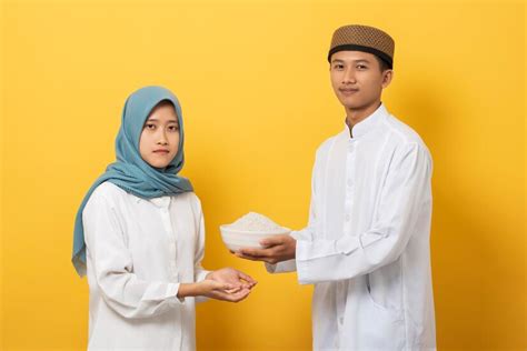 Premium Photo | Giving alms or charity concept Young muslim man give ...