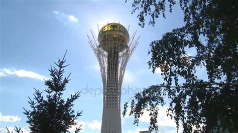 A Water Tower of 1950S Surrounded With Green Trees and One Electric ...