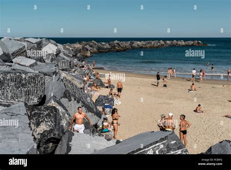 People sunbathing on Zurriola beach, San Sebastian, Donostia, Basque ...