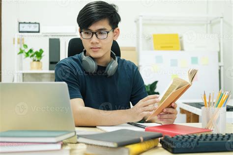 Young man study in front of the laptop computer at home 7190432 Stock ...