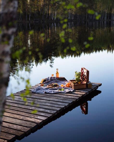 a picnic is set up on a dock by the water