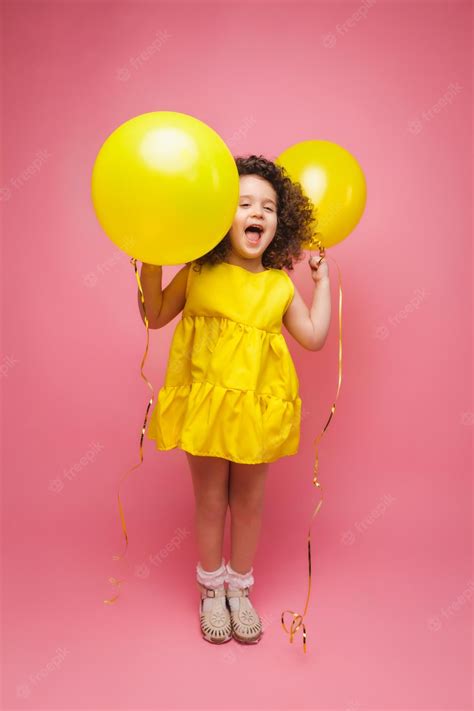 Premium Photo | Portrait of a cheerful little girl isolated on a pink ...