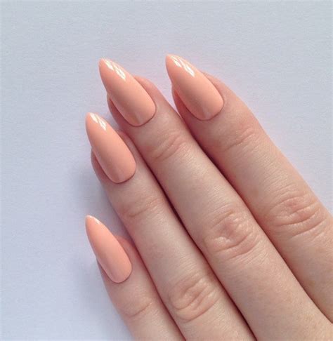 Pastel peach stiletto nails Nail designs by prettylittlepolish