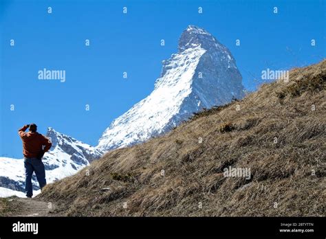 Hiker and Matterhorn Stock Photo - Alamy