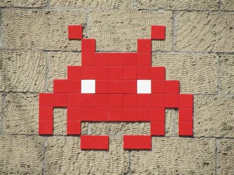 Urban street artist Invader has installed tile mosaics modeled after ...