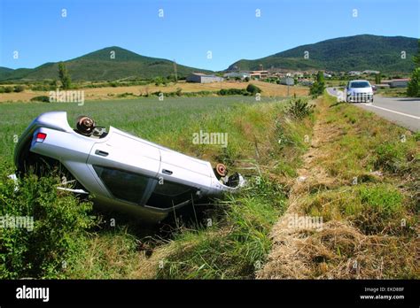 Car crash accident upside down vehicle Stock Photo - Alamy