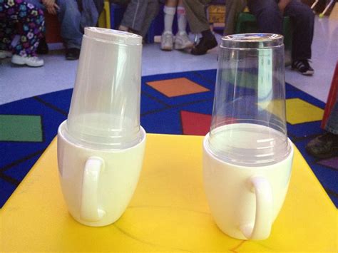 Evaporation Experiment: two cups with water, heat one and put clear ...