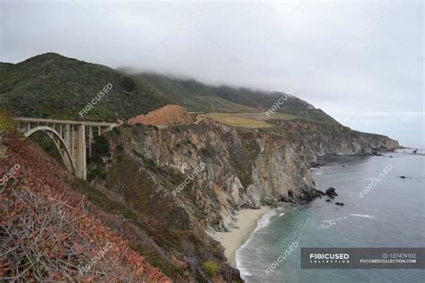 Bixby bridge along top of rugged cliffs — scenics, Built Structure ...