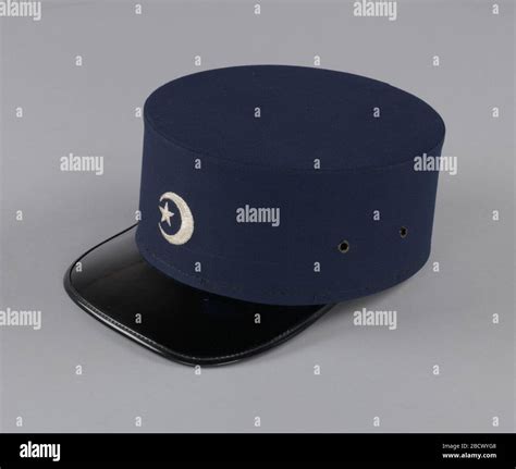 Cap from Fruit of Islam uniform. Navy blue cap with black patent ...