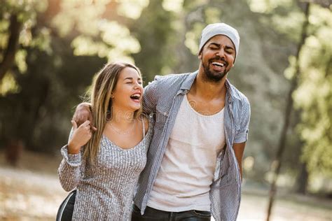 Portrait of Romantic and Happy Mixed Race Young Couple in Park Stock ...