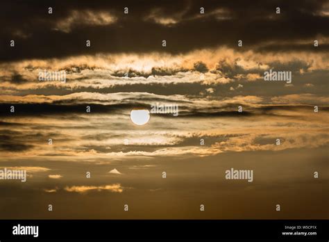 yellow sunrise sky with clouds Stock Photo - Alamy