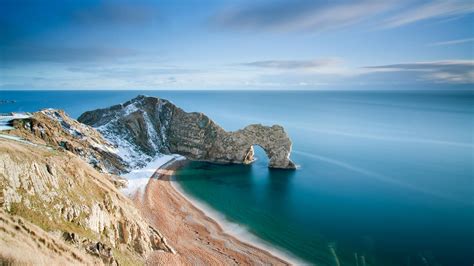 beautiful rocky blue sea wallpaper