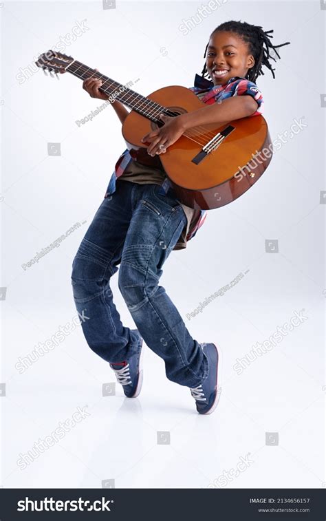 Young Boy Playing Guitar: Over 21.266 Royalty-Free Licensable Stock ...