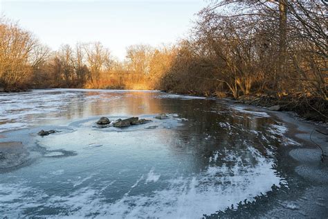 Layered Textures and Light - Frozen Pond Sunrise Photograph by Georgia ...