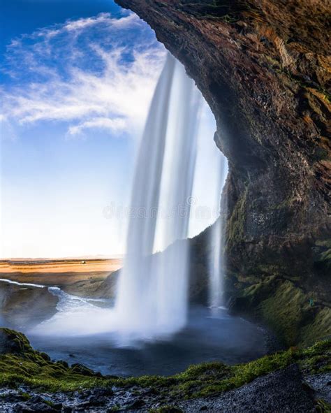 Cave Behind Seljalandsfoss Waterfall in Iceland with Long Exposu Stock ...