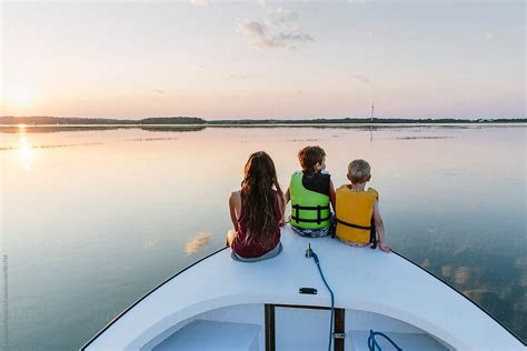 "Children Going For A Boat Ride" by Stocksy Contributor "Raymond Forbes ...