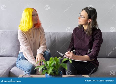 Teen Girl Giving Interview To Social Worker. School Psychologist ...