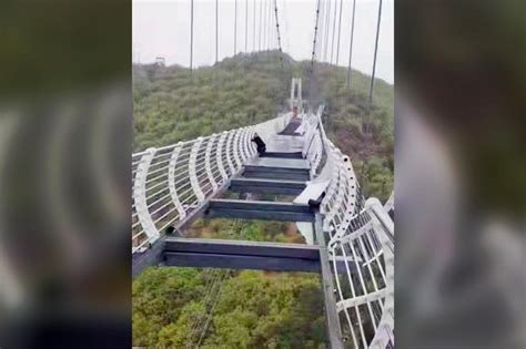 Tourist hangs on from shattered glass bridge in China