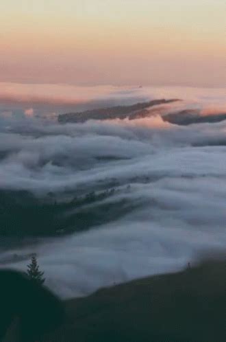 Clouds Fog GIF - Clouds Fog Mountains - Discover & Share GIFs