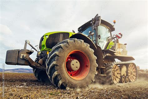 Modern tractor working on the farm, a modern agricultural transport ...