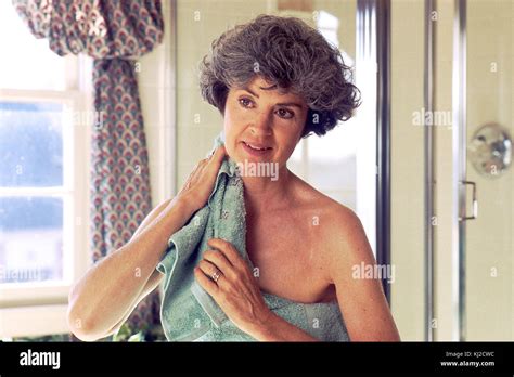 Woman drying off with a towel Stock Photo - Alamy