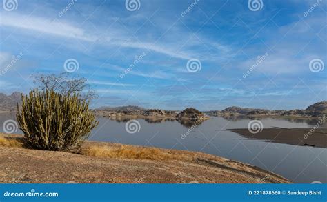 View of Jawai Dam with Water and Clouds Stock Photo - Image of rock ...