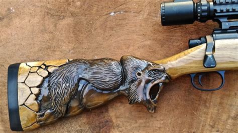 Hand carved Gun Stock from Taring Carving Indonesia - YouTube