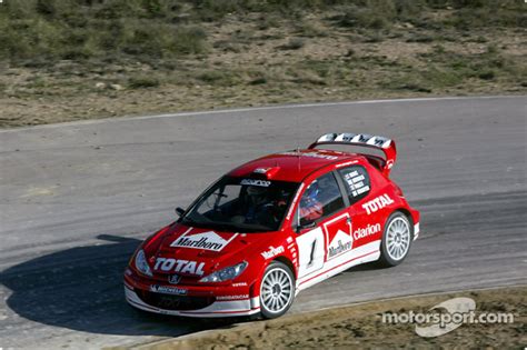 Gilles Panizzi in the new Peugeot 206 WRC 2003 at Peugeot 206 WRC 2003 ...