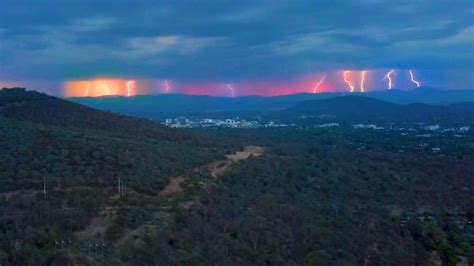 Canberra weather: Storm lights up capital but hot days still ahead