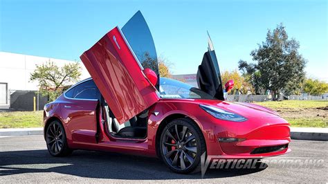 Tesla Model 3 from California featuring Vertical Doors, Inc., vertical ...