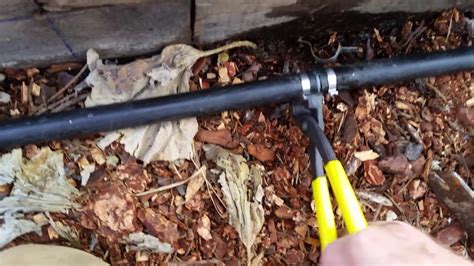 Repairing a leak in the irrigation pipe using a poly pipe crimp sleeve ...