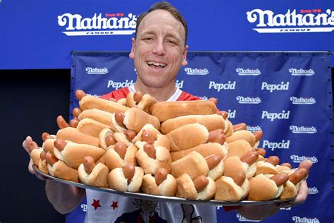 Joey Chestnut Eats 62 Hot Dogs to Claim 16th Title in Nathan's Fourth ...