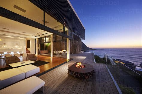 Fire pit on modern luxury home showcase beach house at sunset stock photo