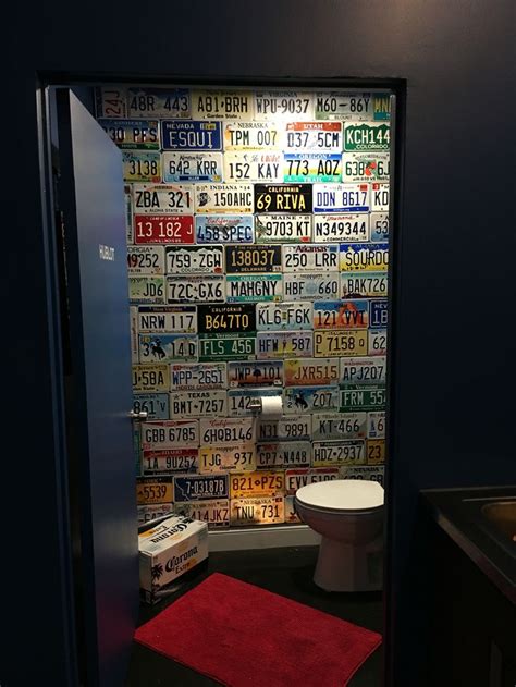 Warehouse bathroom | Plates on wall, License plate decor, License plate