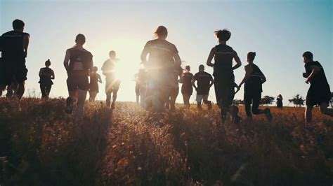 Group Of People Running On Field In Sunset Stock Footage SBV-304654697 ...