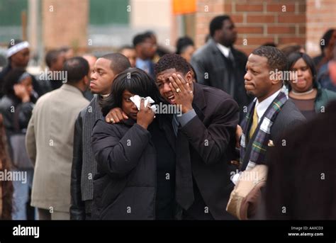 People Crying At A Funeral