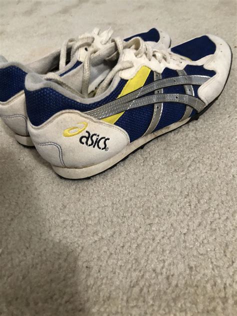 A pair of 15-25 year old racing flats from asics. Please help me find ...