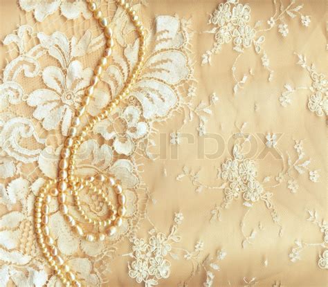 Wedding background with cream silky decoration accessories, lace and ...