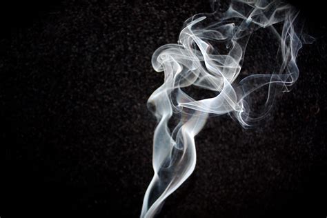 Black Background Smoke : Silhouette of white smoke on black background ...