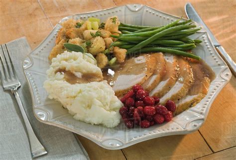 Thanksgiving dinner on plate - Stock Photo - Dissolve