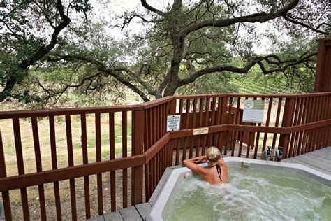 lindsay soaking in a mineral springs tub with vineyard views at river ...