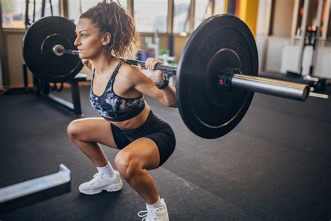 How To Do a Barbell Squat, According to Trainers - Parade