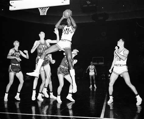 Kansas Jayhawks Basketball Wilt Chamberlain grabs a rebound during a ...