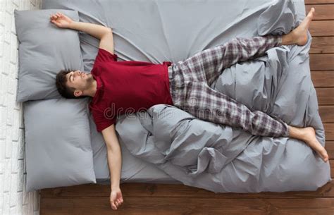 Man Sleeping in Bed at Home Stock Photo - Image of homely, comfortable ...