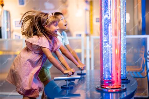 Premium Photo | Kids playing in science museum